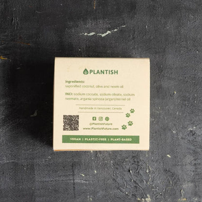 Plantish product label on a textured black background