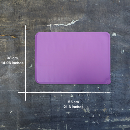 Purple cutting board with measurements on a textured black surface